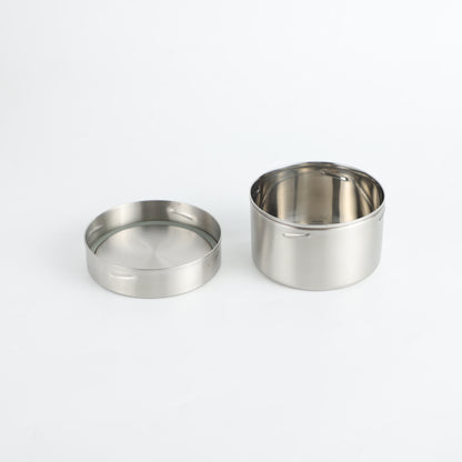 Snack pot with its lid off on a white background. 